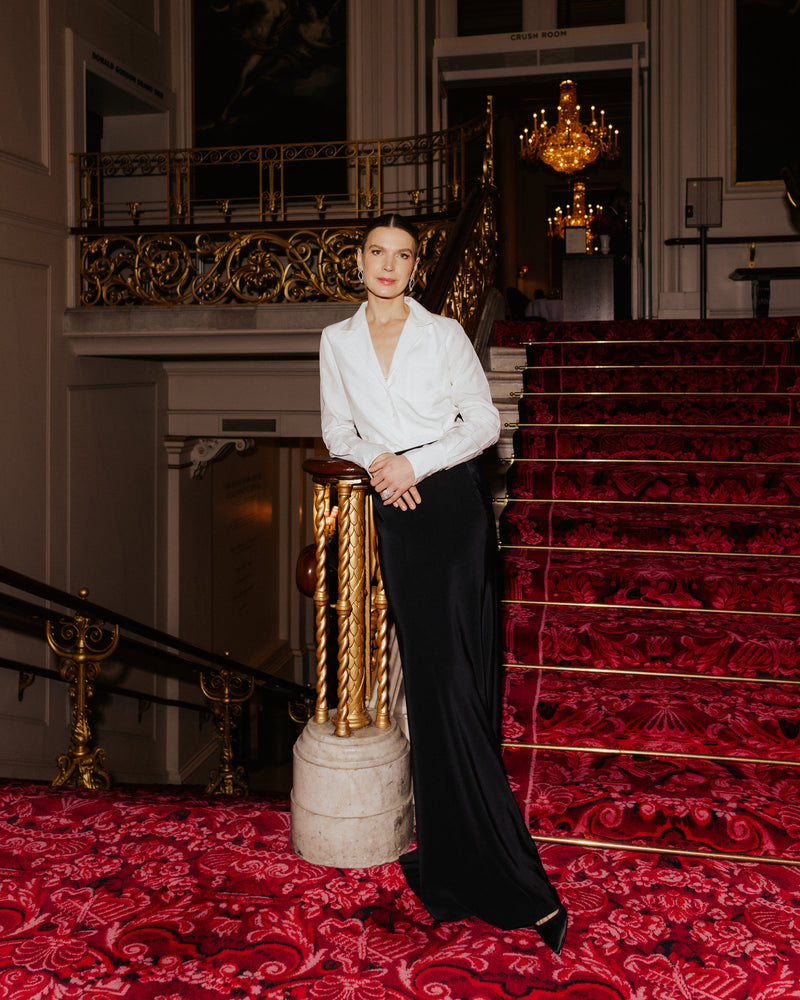 Indre Serpytyte-Roberts attended the Royal Opera House wearing Sienna Shirt in Silk Cupro and Giulia Skirt in Obsidian Silk Satin.