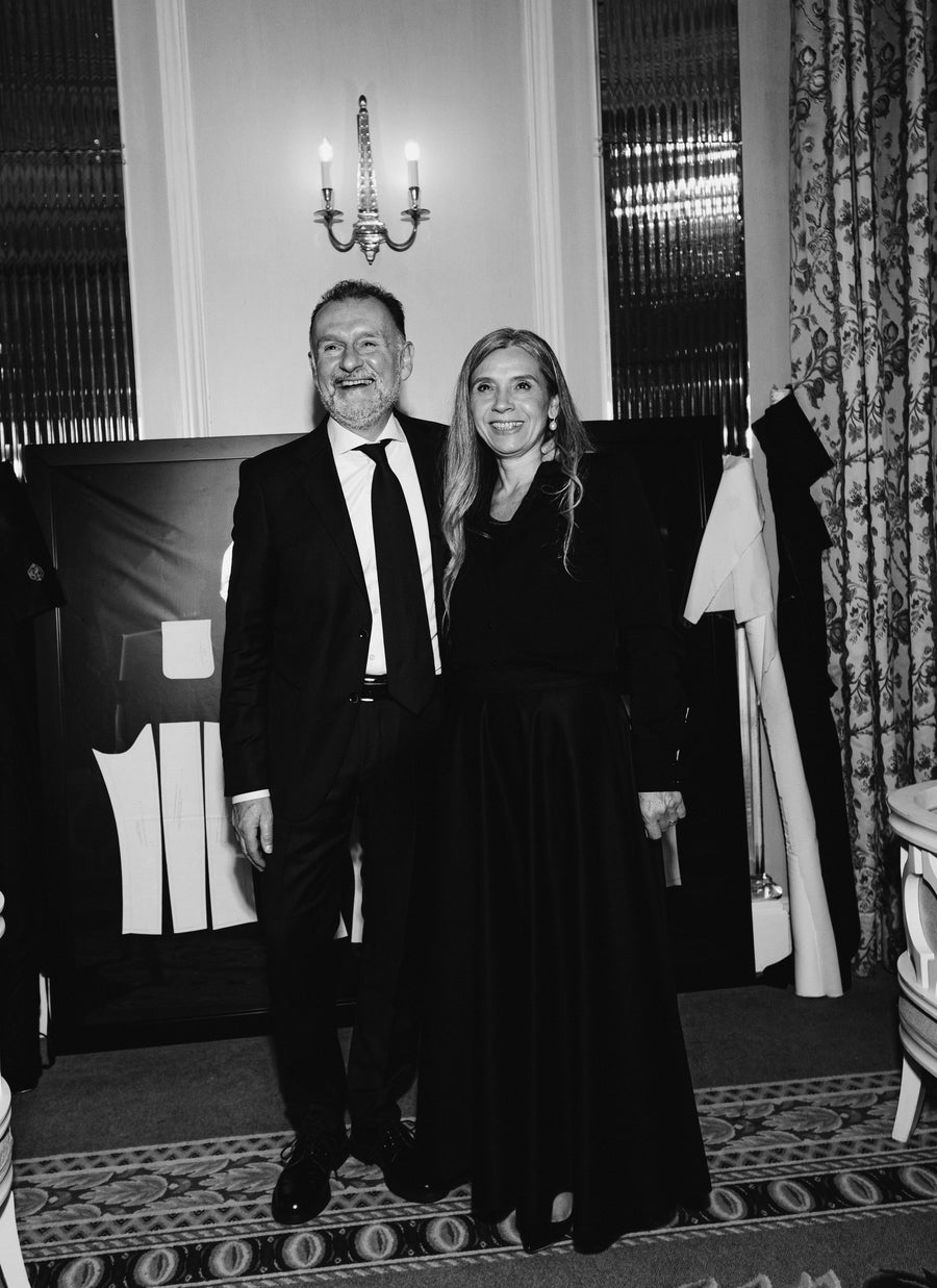 (L) Antonella wearing her signature skirt with her husband, Mauro at the Salon Presentation. (R) Antonella presenting the Isabella Jacket and Antonella Skirt in Virgin Wool and Mohair with the Atelier's Venice tailors.