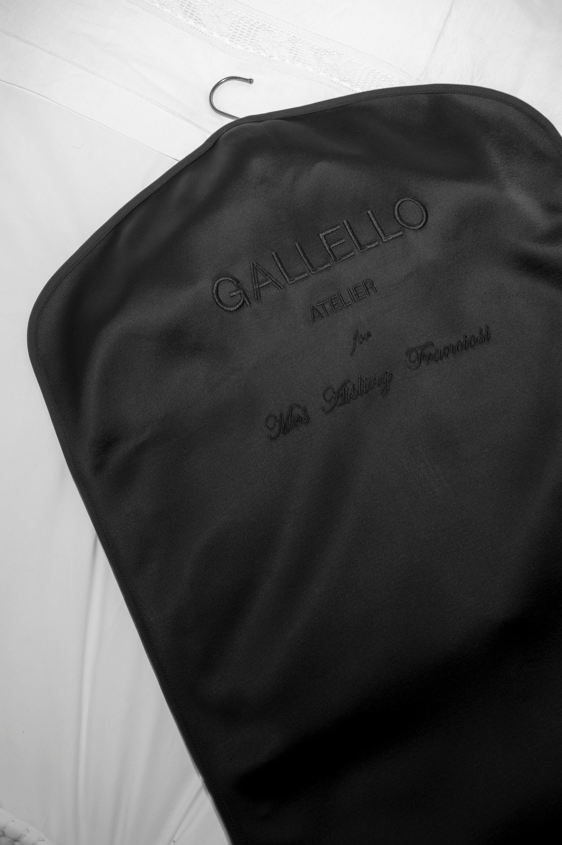 Each piece has its own garment bag embroidered with personalised details. The Atelier creates each garment bag in the studio using deadstock and leftover fabric.