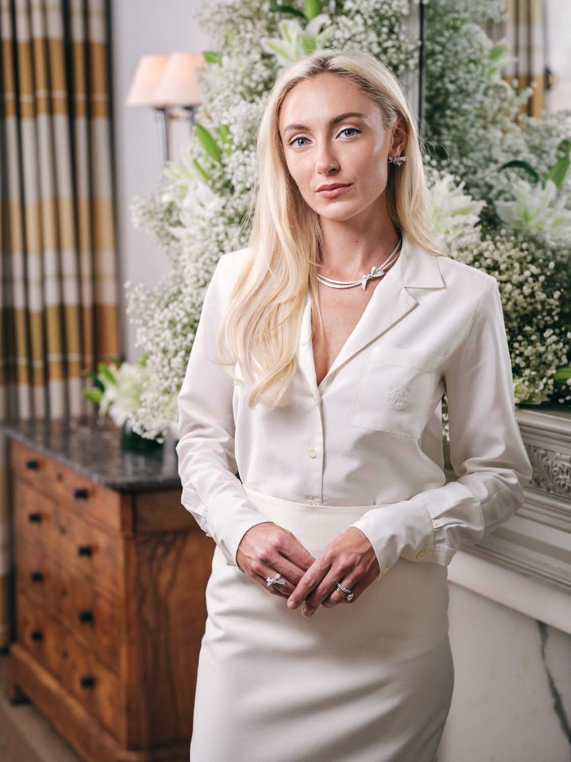 Stacey Gallello, Founder & CEO, wearing the Sienna Shirt and Chiara Skirt and the Tilda's Bow collection from the Atelier's jewellery partner, Graff. The two houses celebrate family heritage craftsmanship.